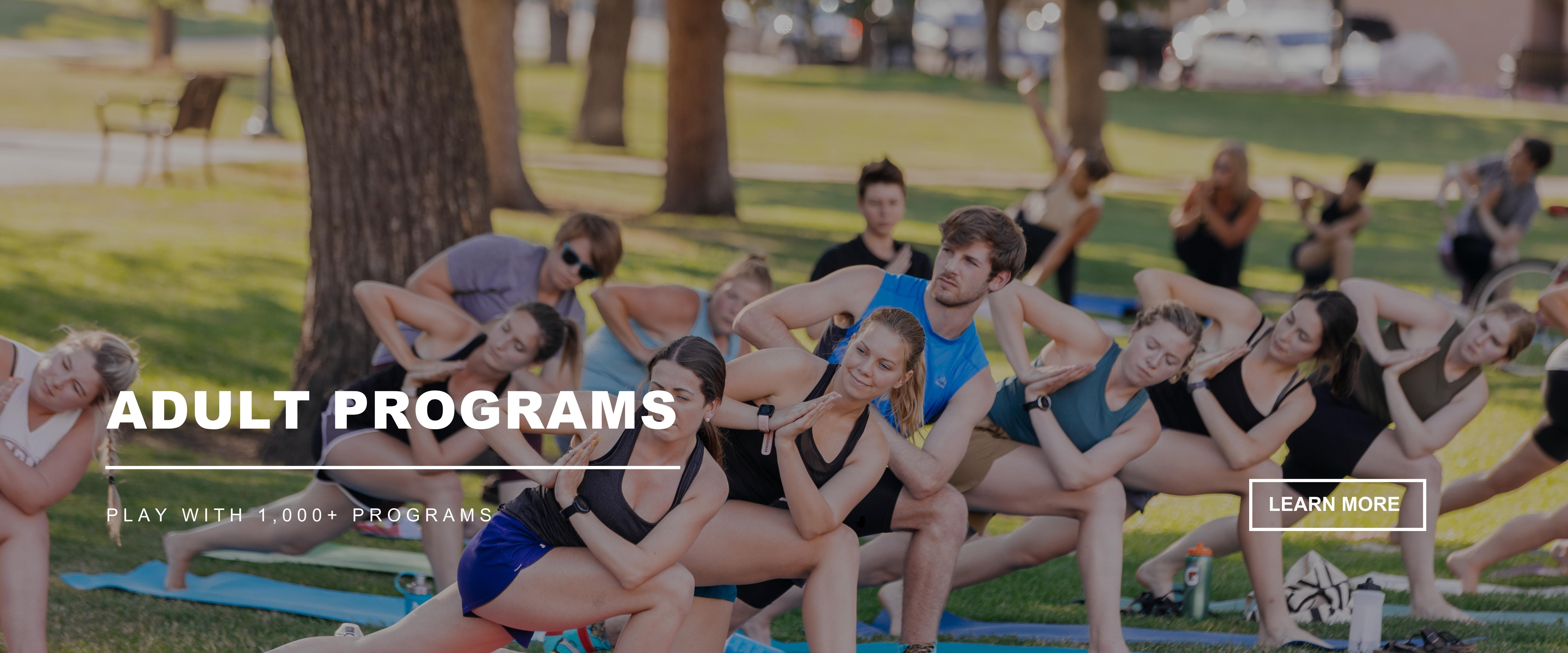 ADULT PROGRAMS - Play with 1,000+ Programs - 10+ adults doing outdoor yoga in a park