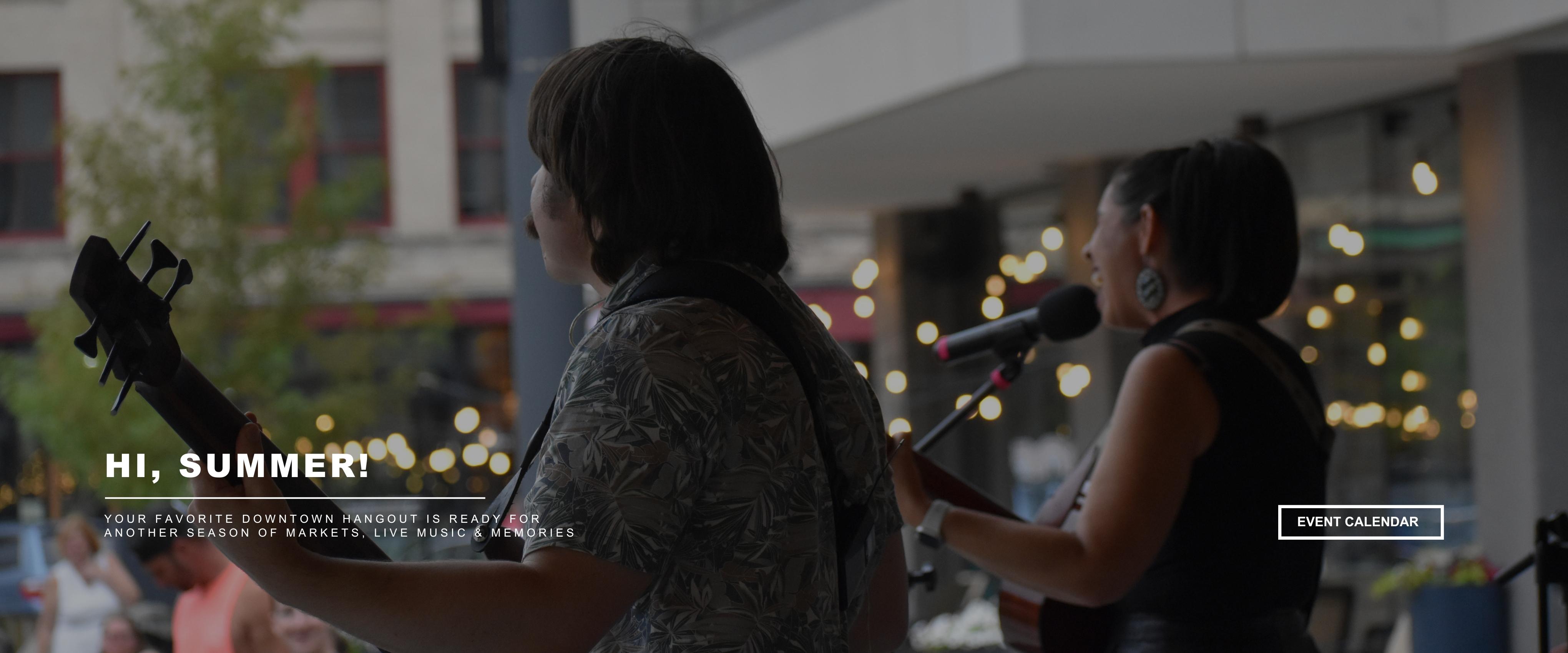 This image shows musicians in the square with a button to view our event calendar
