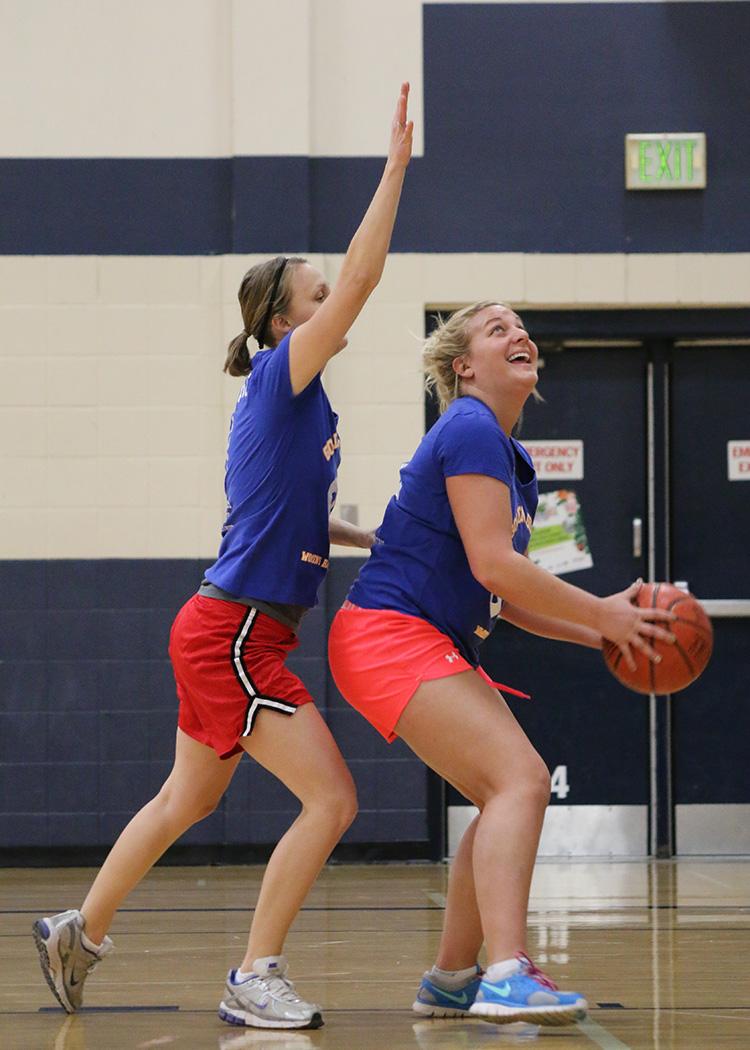 This image shows two females at the adult basketball program.