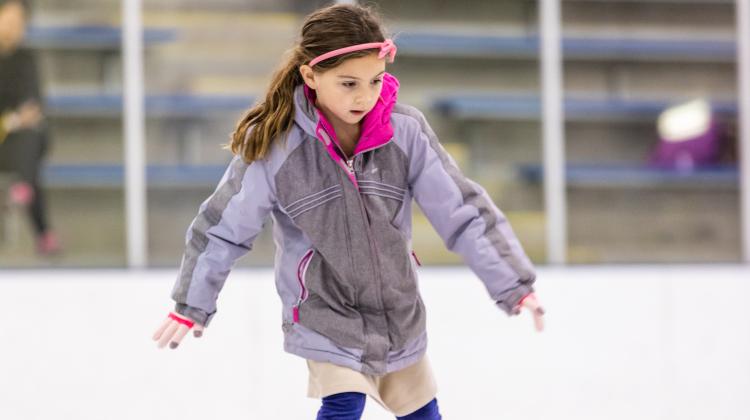 This image shows a girl ice skating.