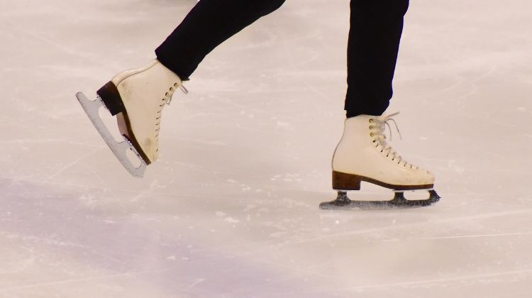 This image shows someone skating during adult skating lessons.