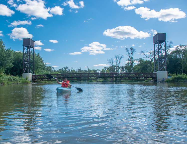 This photo shows a boy kayaking at Lindenwood Park.