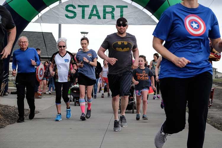 5krun Photo shows runners leaving the starting line of 5k run.