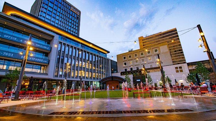 This image shows Broadway Square during a summer evening.