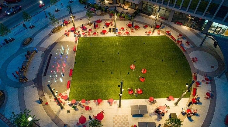 This image shows an aerial view of Broadway Square on a summer night.