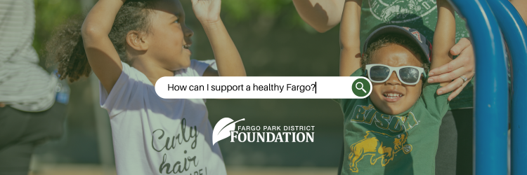 Foundation_Header_Donate.png This photo shows 2 kids playing on a playground with the words in a search engine saying how can I support a healthy Fargo?