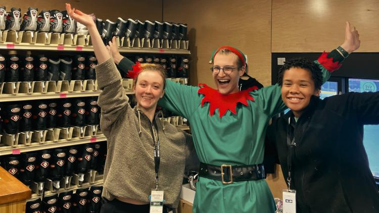 This image shows 3 smiling skate shack attendants