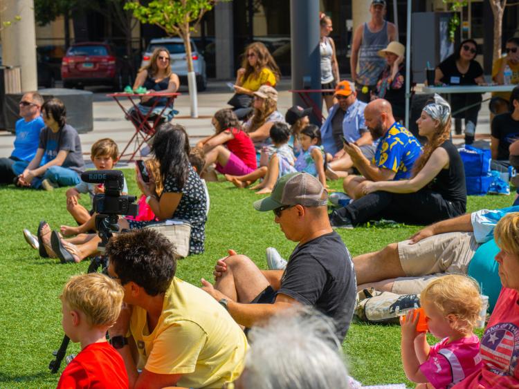 This image shows families gathered at Broadway Square.