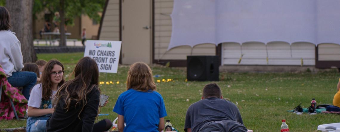 Crowd of people watching a movie at Rheault Farm