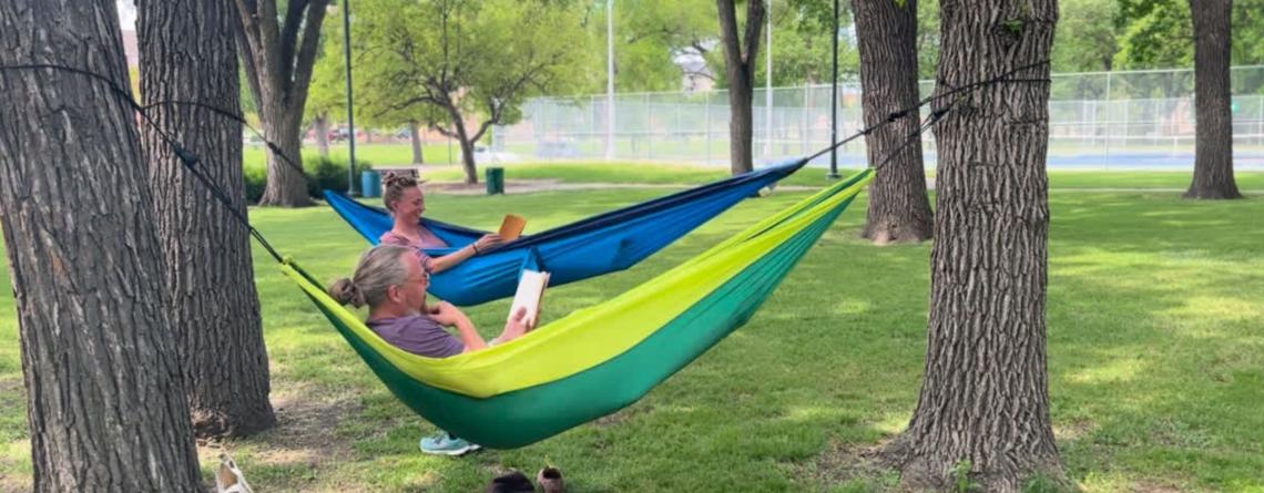 two people hammocking in island park