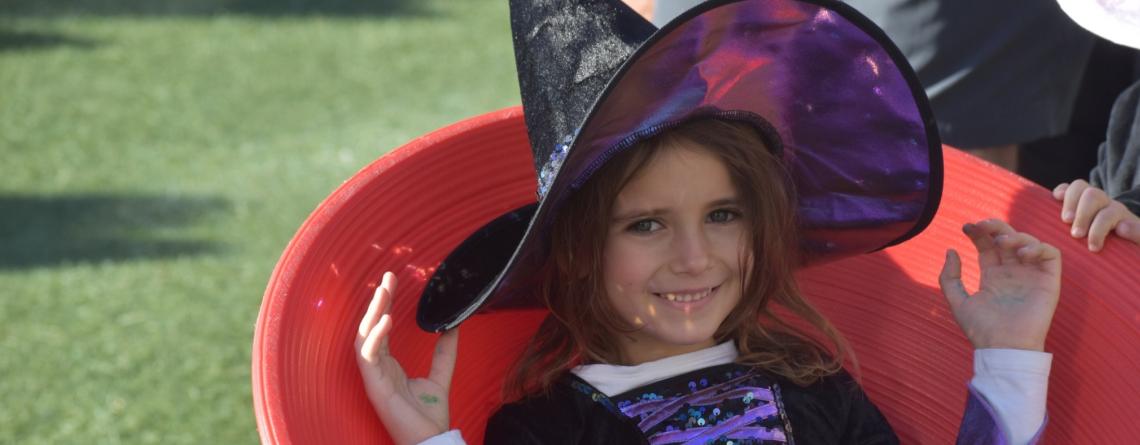 Girl in witch costume at Square Scare event