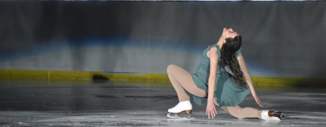 Photo of girl ice skating in the ice revue show