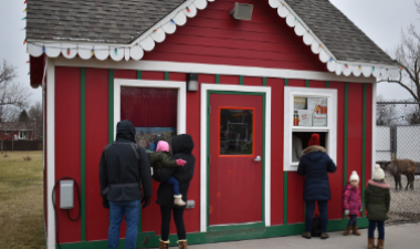 This image shows people checking in at Santa Village.