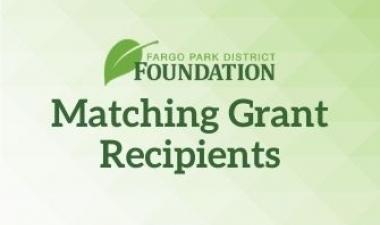 This image shows a green background with the Fargo Park District Foundation logo and the words Matching Grant Recipients in the middle.