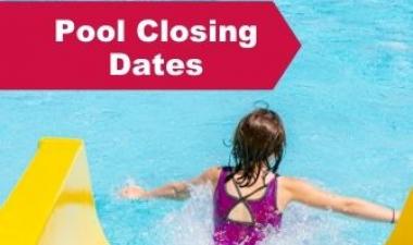 This image shows a girl in a pool next to a slide.