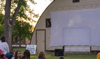 Crowd of people watching a movie at Rheault Farm