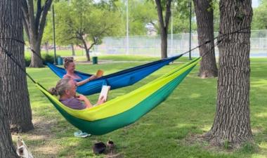 two people hammocking in island park