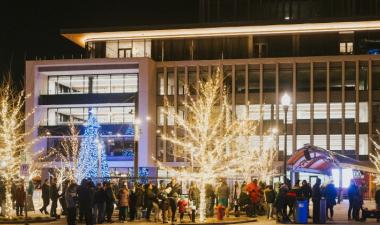 image of people standing around broadway square during winter