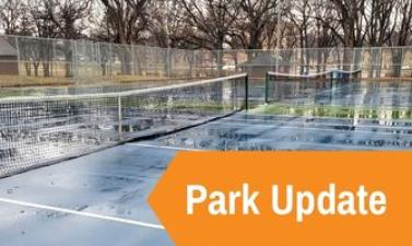 This image shows a tennis courts with nets in place with an orange arrow and text reading Park Update.