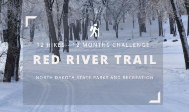 Wintery picture of park trail, with grey box and white text that says 12 Hikes-12 Months Challenge Red River Trail North Dakota State Parks and Recreation