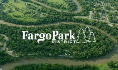 This image shows and aerial view of Island Park with the Fargo Park District new logo on it