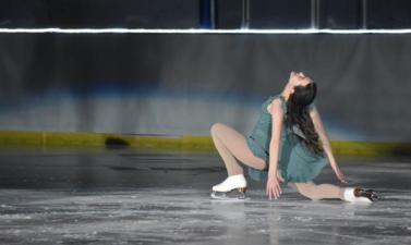 Photo of girl ice skating in the ice revue show