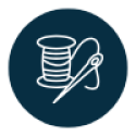 Navy circle with white icon of a spool of thread and needle