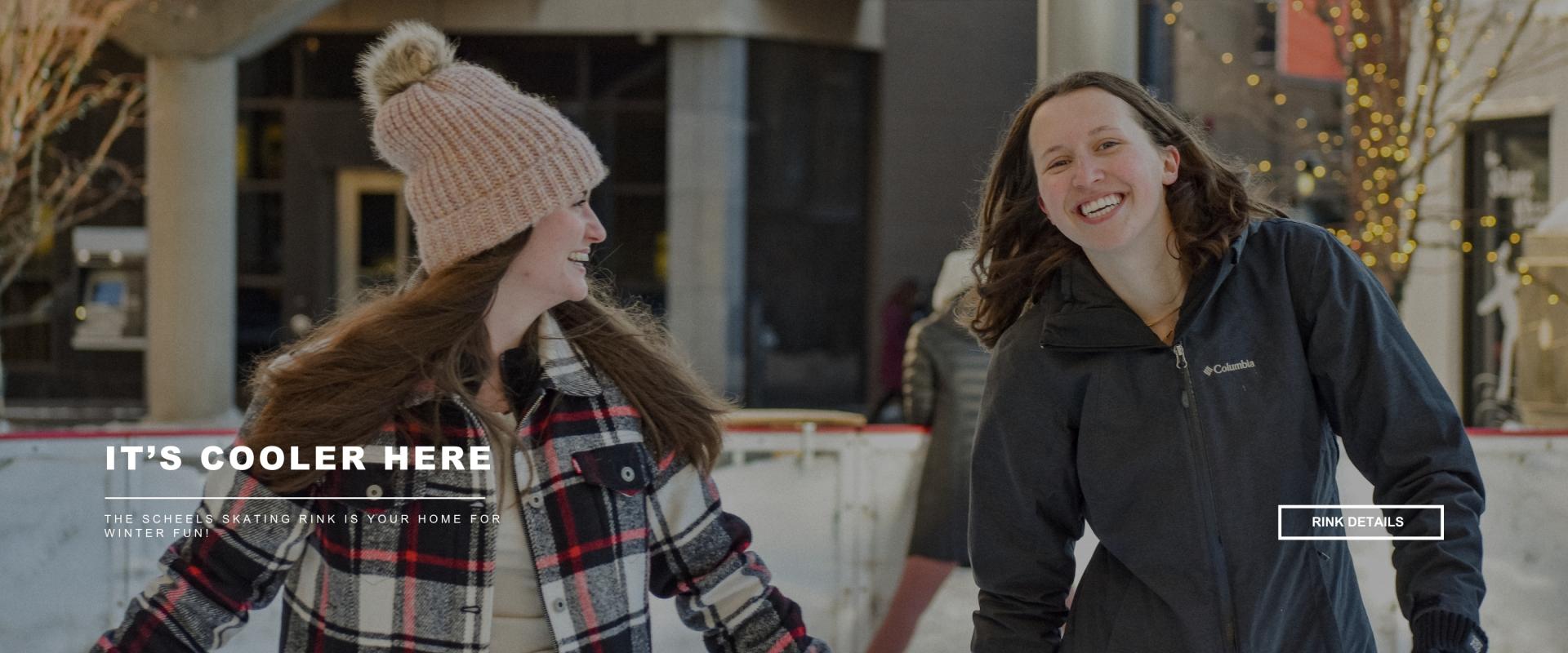 this image shows two women skating and smiling at the square with text that says its cooler here with a button to learn more about the rink