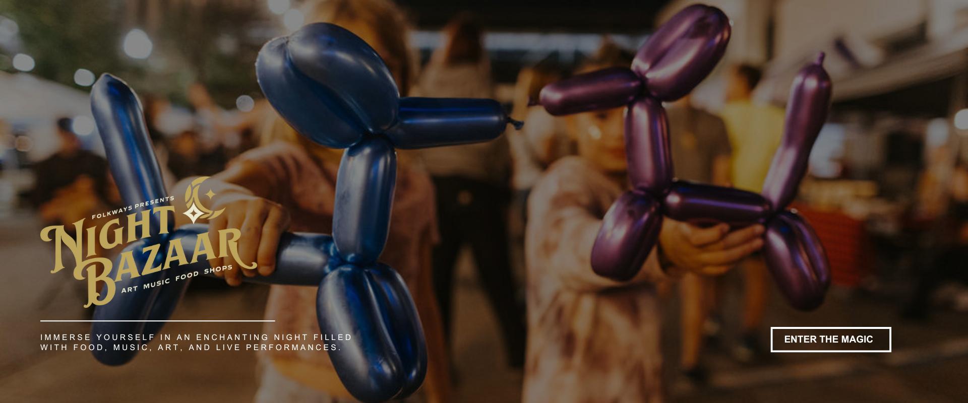 Children holding colorful balloon animals at an outdoor event at night with festive lights in the background. Text overlay reads “Night Bazaar – Art, Music, Food, Shops."