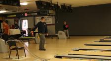 This image shows some people bowling with the adaptive bowling program.