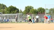 This image shows a female batting during the adaptive softball program.