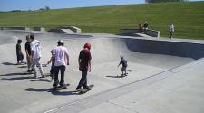 This image shows a group of skateboarders at the skate park.