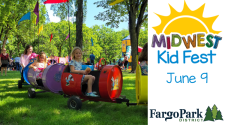 Photo of barrel rides at Island Park with Midwest Kidfest logo.