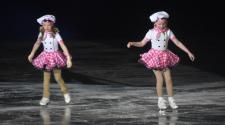 two girls in pink and white chef outfits ice skating to a routine for the Fargo Parks Ice Revue